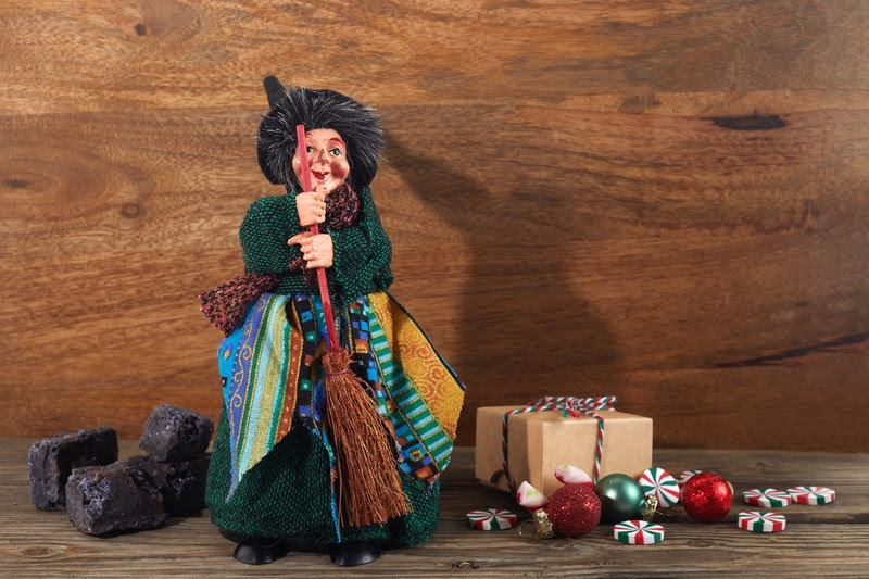 The Befana with sweet coal and candy. Italian Epiphany day tradition. The Befana with sweet coal and candy. Italian Epiphany day tradition.